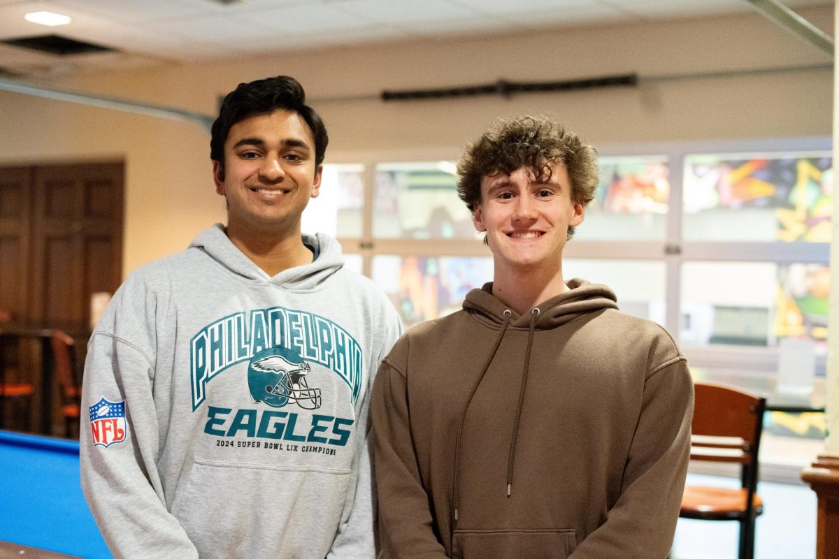 Neal Gupta and Evan Levasseur smile for a portrait.