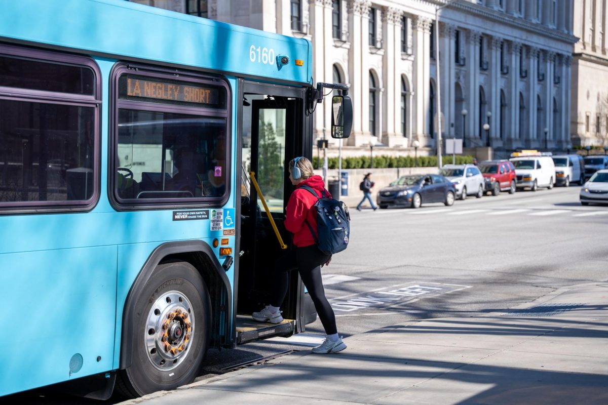 A student boards PRT bus 71A.
