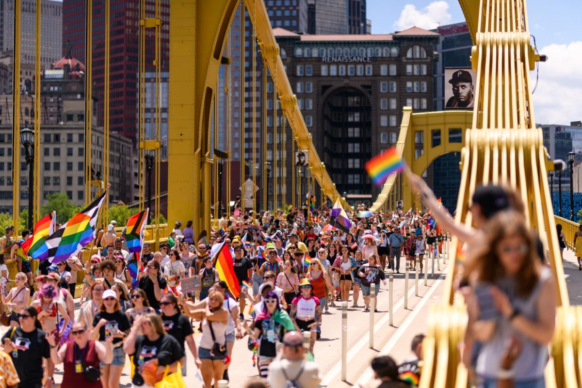 Marchers walk down the Roberto Clemente Bridge during the Pittsburgh Pride Parade on June 7, 2026.